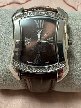 Burgi Quartz Movement women's watch with brown genuine leather band.